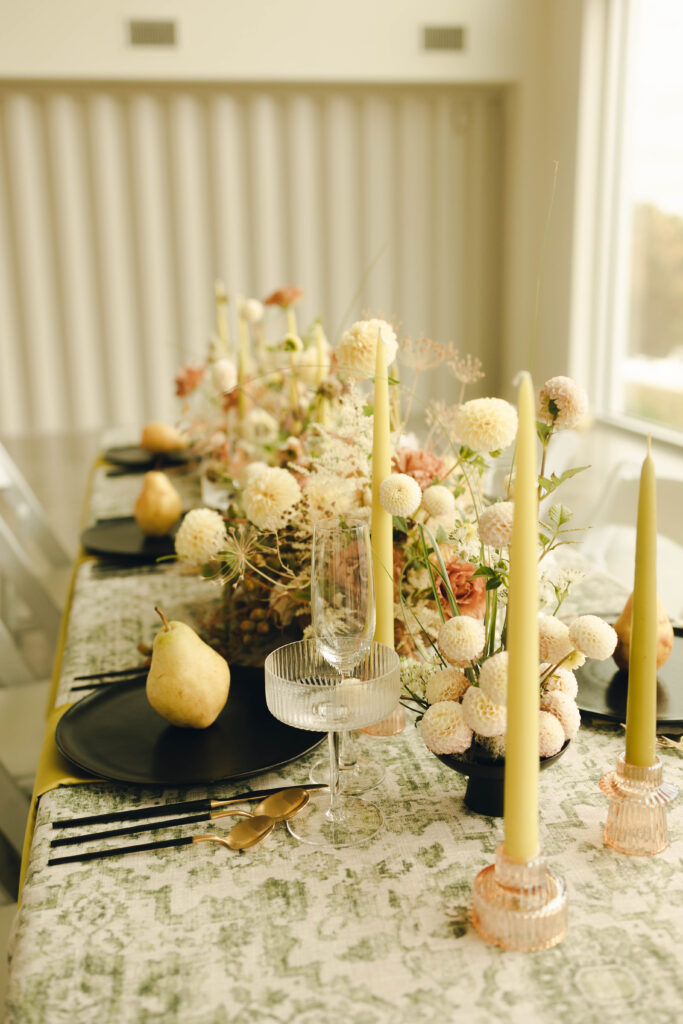 whimsical wedding tablescape with candlesticks and dreamy florals